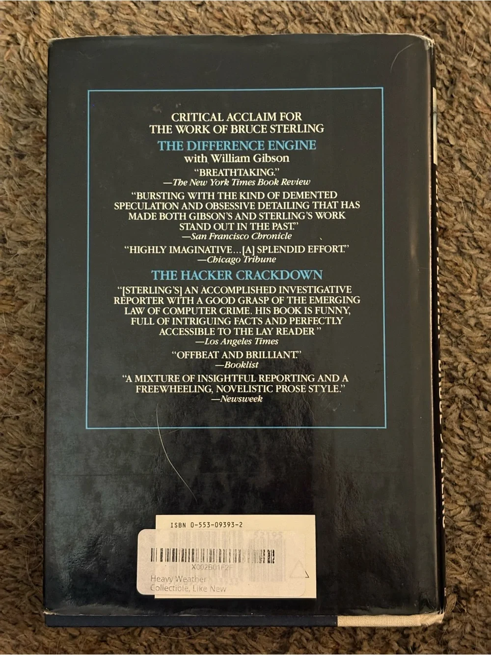 Heavy Weather by Bruce Sterling - The Suspect by John Lescroart. GUC.